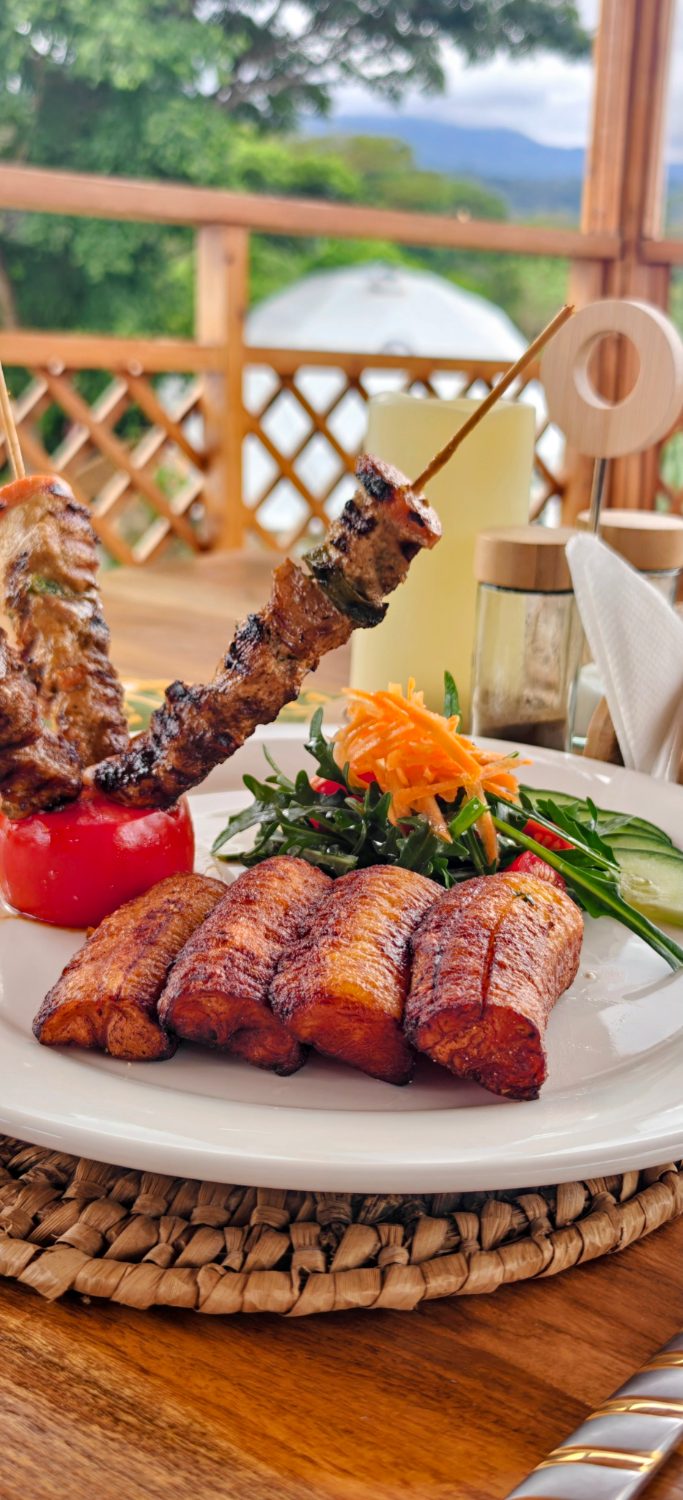 Grilled skewers and glazed pork belly on the restaurant deck