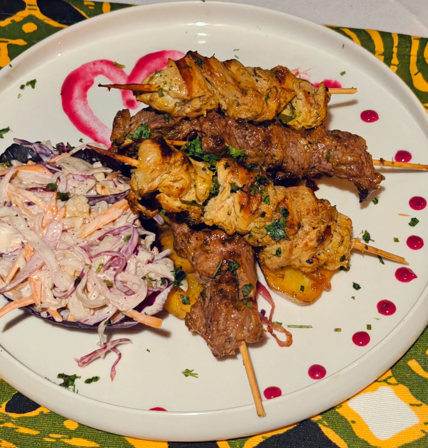 Mixed nyama choma skewers with citrus slaw
