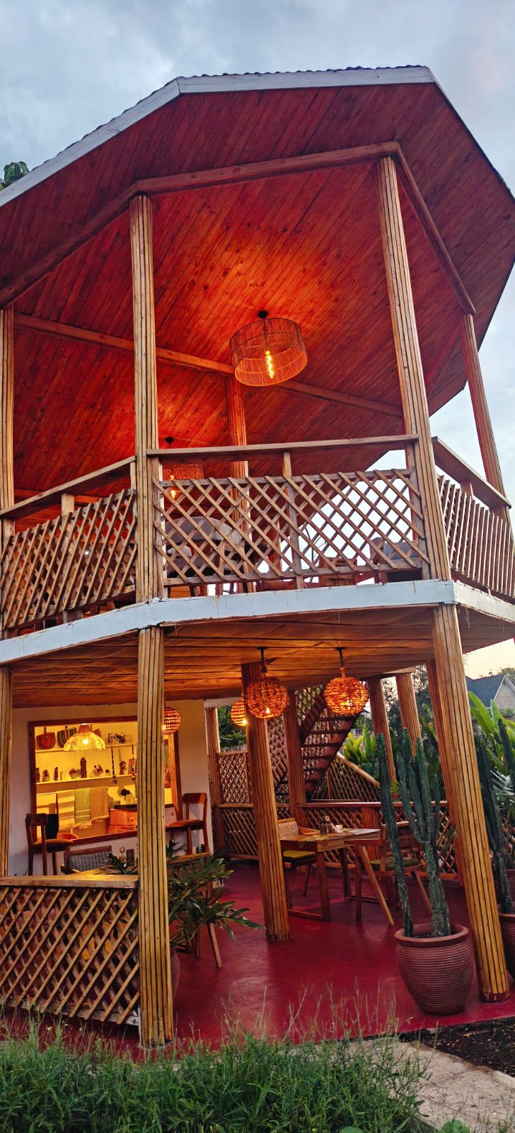 The timber treehouse restaurant glowing in the evening